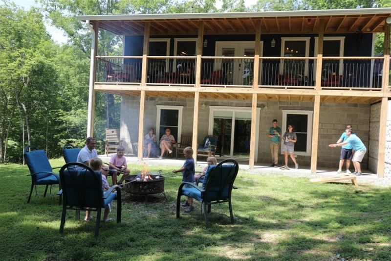 A family gathered on the lawn behind Blue Haven on Paradise Point, Norris Lake