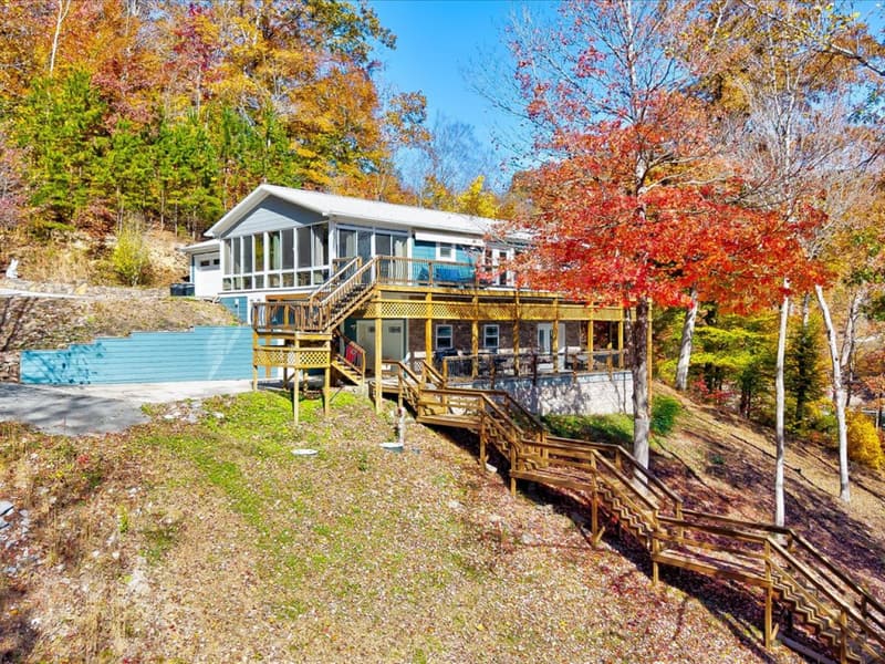 Lakefront Paradise in fall color, decks stepping down toward the lake