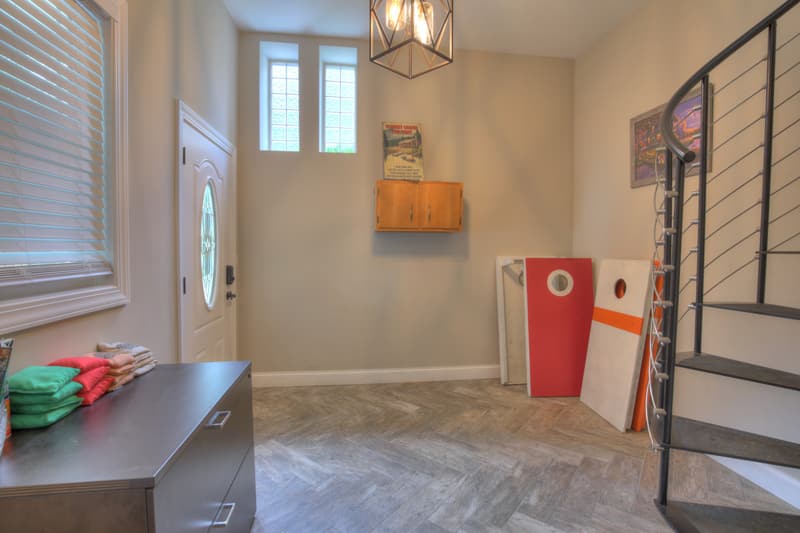 Lower-level entry with two cornhole sets